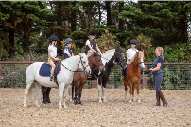 Image of kids at riding lessons